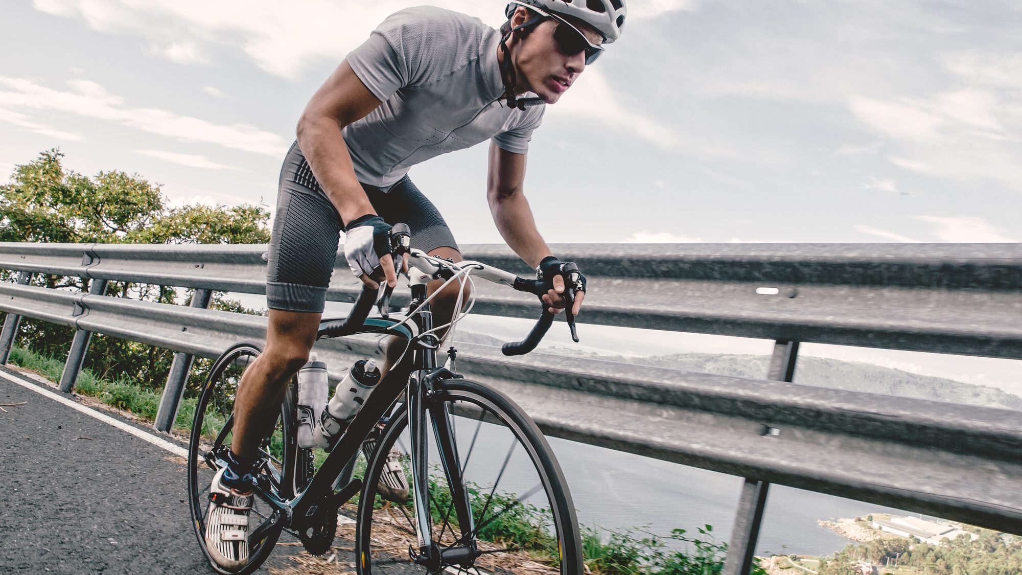 Cyclist in maximum effort in a road outdoors